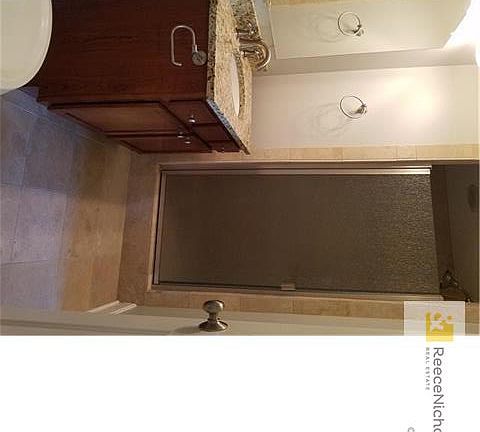 Full bath near 2nd bedroom and kitchen.