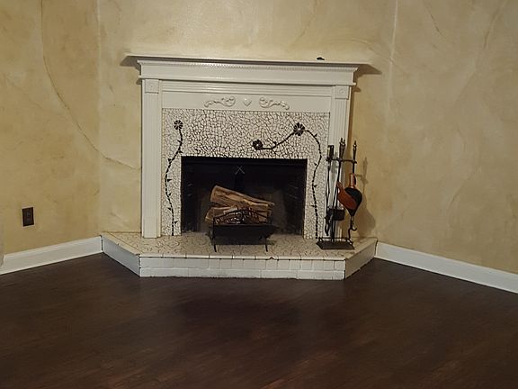 Hand mosaic tiled fireplace 