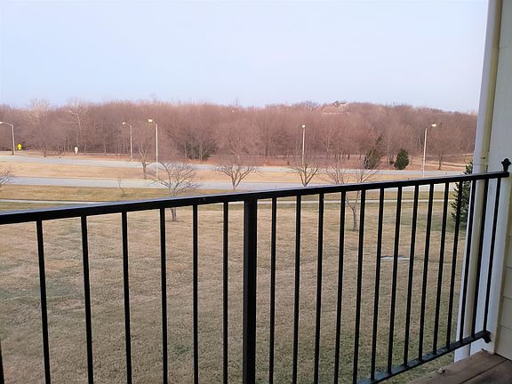 2nd floor balcony overlooking trail and park area across Tomahawk Creek Pkwy