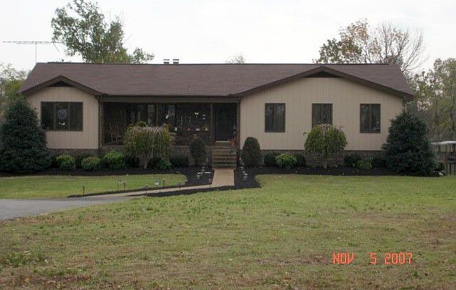 Front of home. Great landscaping. "Rocking Chair Front Porch"  