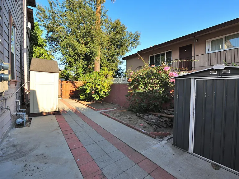 HUGE PRIVATE BACKYARD (1000 SF) WITH 2 STORAGE SHEDS