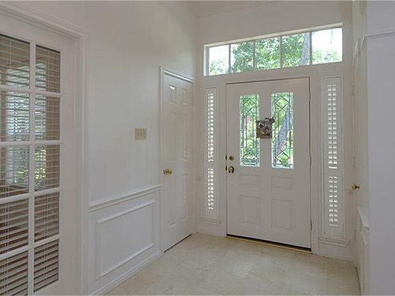  The extended entry features this gorgeous marble! The French doors on the left are to the study.