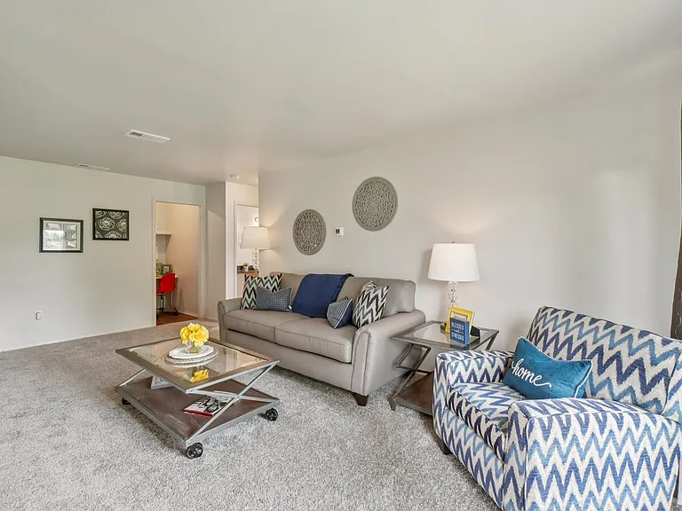Elevated living room and private patio or balcony at Drawbridge Apartments in Harrison Township, MI.