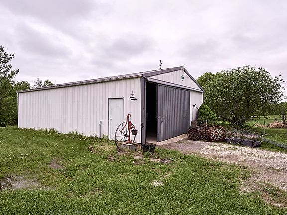 30'x40' outbuilding with water, electric, and 1/2 concrete floor