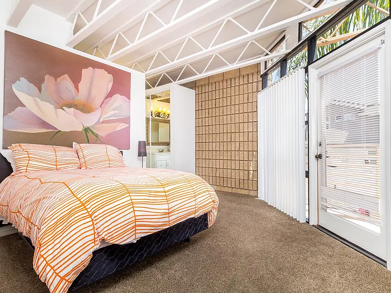2 of the bedrooms very large great modern ceiling detail leading to balcony area