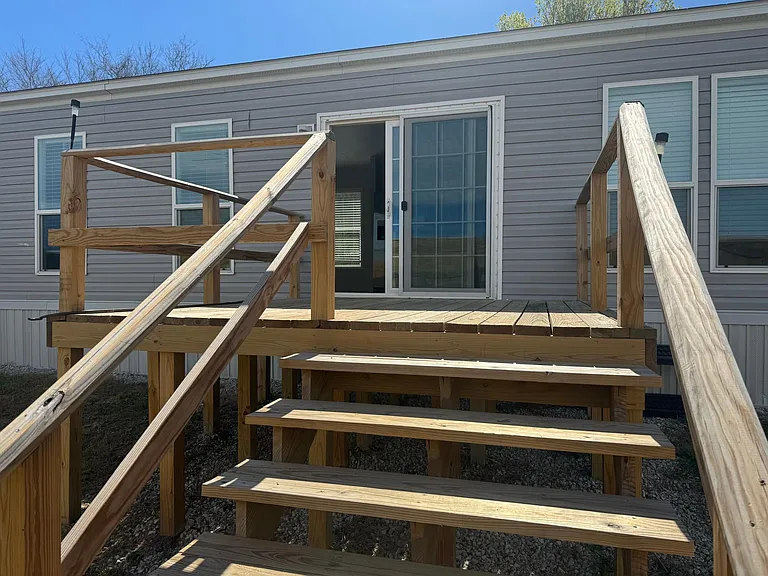 Backyard deck. Plenty big for grill, table, etc.