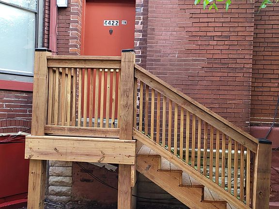 Newly built deck for side entrance into the unit.