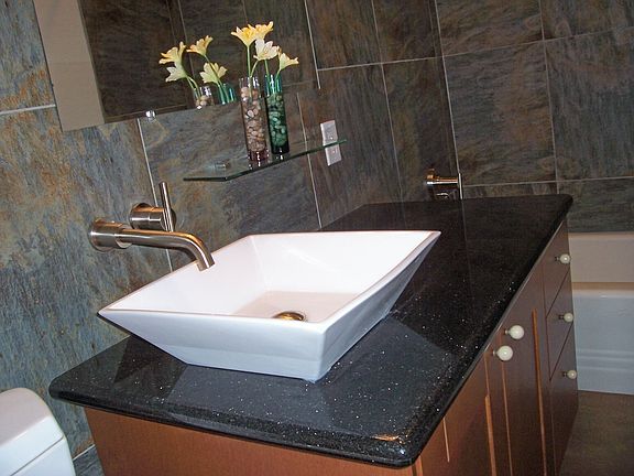 Check out the vessel sink and tile work