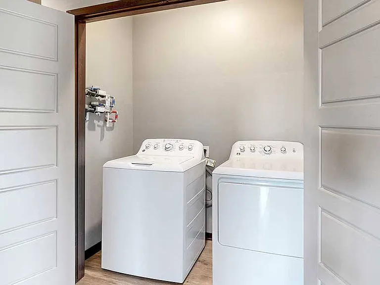 Handle laundry with ease in a dedicated room with full-size appliances.