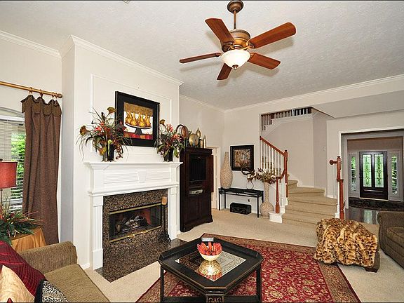 The fireplace has a beautiful wood mantle and granite surround.