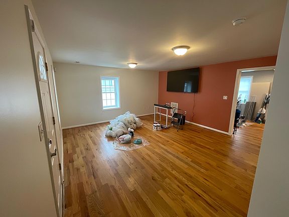 Living Room - please note that the wall is now a neutral color matching the rest of the walls. There is a 1/2 bath for the living room as well as a coat closet.