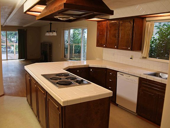 Turn left from the entryway to go into the kitchen.