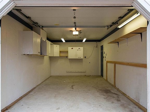 The insulated garage runs 20 feet deep and 12 feet wide and you can access the house from the garage.