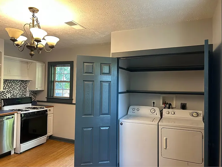 Kitchen area with laundry area (washer and dryer included)