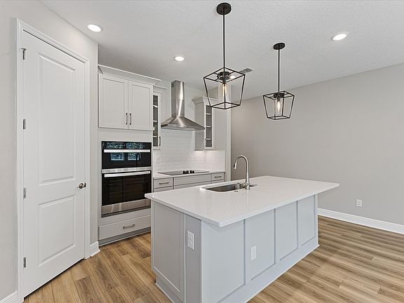 Kitchen in the Corsica floorplan at 328 Birkdale Drive in Legends Preserve