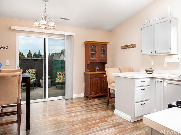 Step right from your beautiful, new flooring to the easy care patio - No Stairs! 