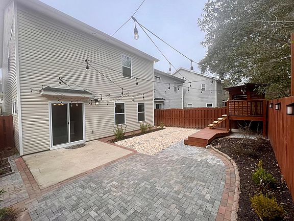 Private back yard with lights and easy maintenance.