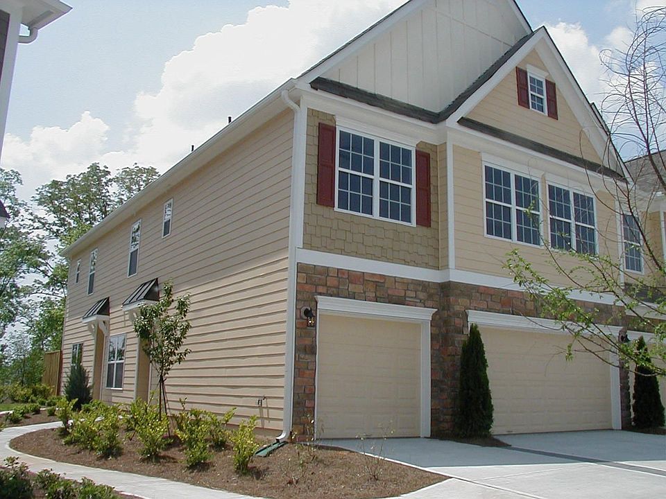 Unit is rear left; 2-car garage in front.