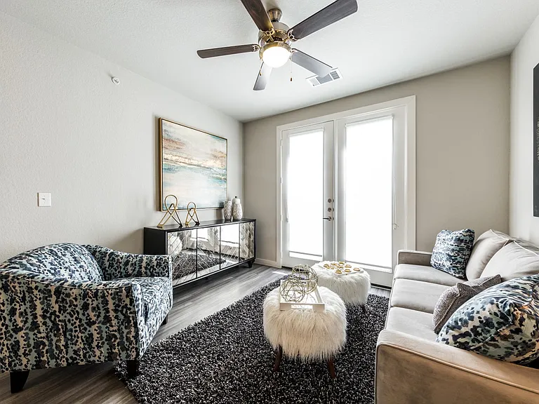 Living room with full-size 3-seated couch, recliner, and cable connections