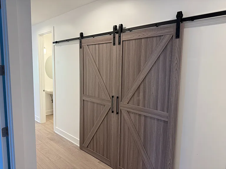 Barn Doors Hide Laundry Area