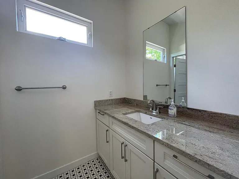 Lot's of counter space and extra cabinets in the Primary bathroom.