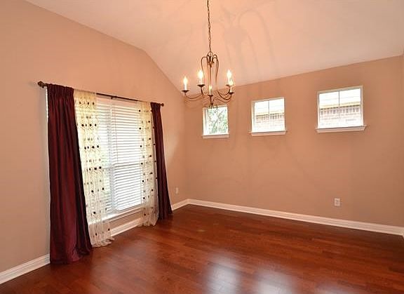 The large dining room offers wood floors and plenty of natural light.