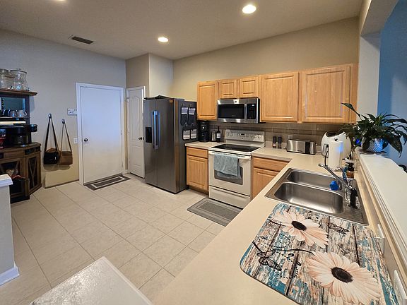 Kitchen with entrance to the Garage