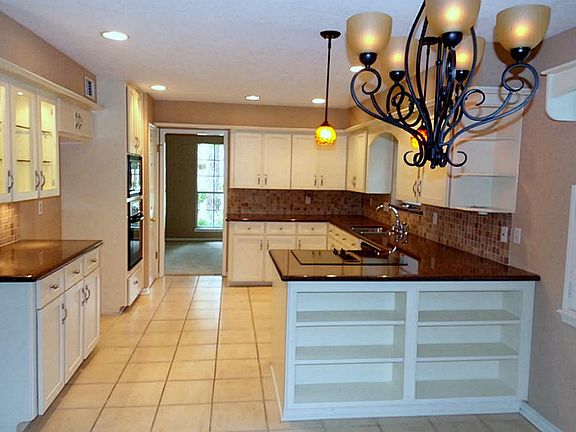 WOW! What a great kitchen.  Granite countertops.  Faced kitchen cabinets and drawers.  Some of the cabinets have glass.  What more could you ask for?