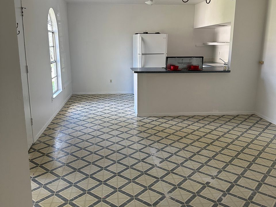 Kitchen and living room: The house has no carpet.