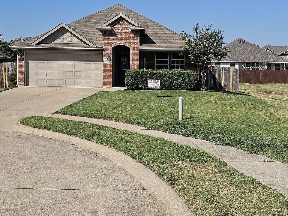 Large cul-de-sac corner lot, beautifully landscaped with front porch and 2 car garage