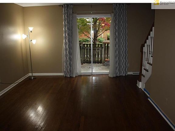 Living room with hardwood floors and access to the patio