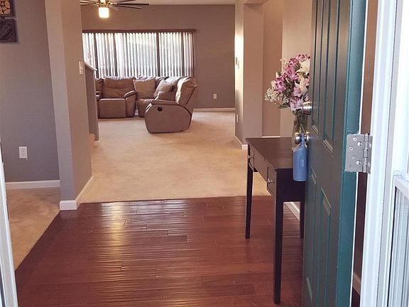 Large Entry Foyer leading to the Flex Room to the left and Dining and Great Room beyond.  The flex Room is currently being used as a Living Room, but could easily become a large well lit home office.