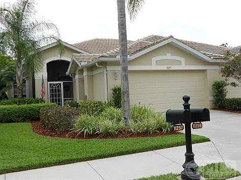Beautiful landscape entryway to 11257 Wine Palm Rd.