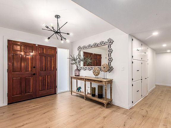 Front entry area
with closet for storage and additional storage cabinets as shown