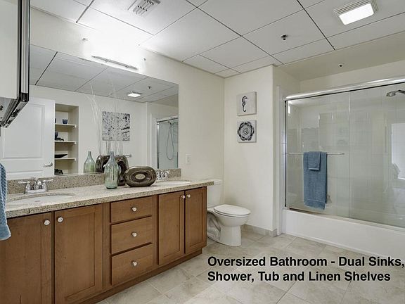 Oversized Bathroom w/ dual vanity, tub and shower.