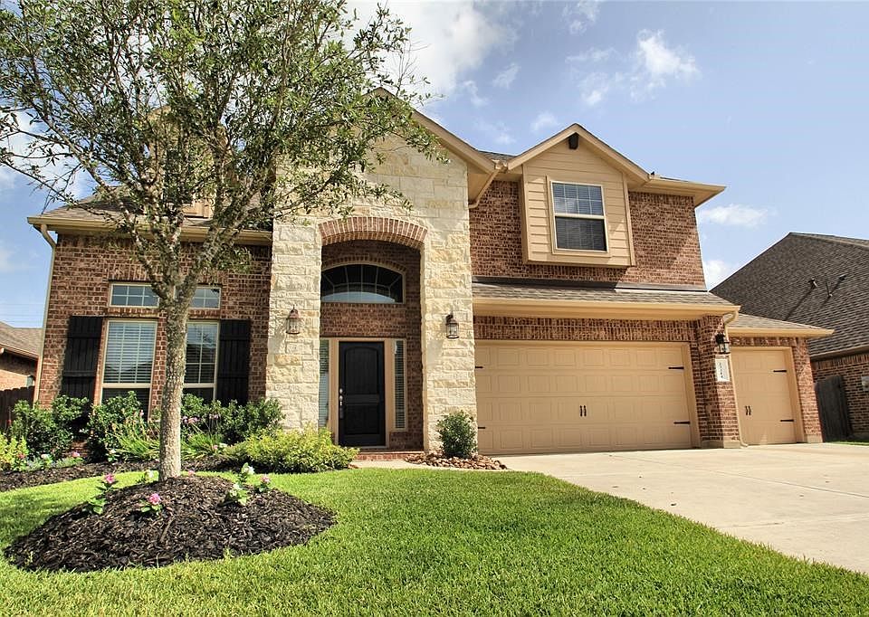 Lovely 2 story floorplan with brick and stone elevation. 3 car side by side garage