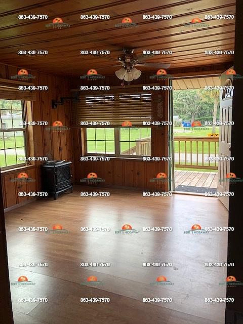 Livingroom with knotty pine walls and ceiling