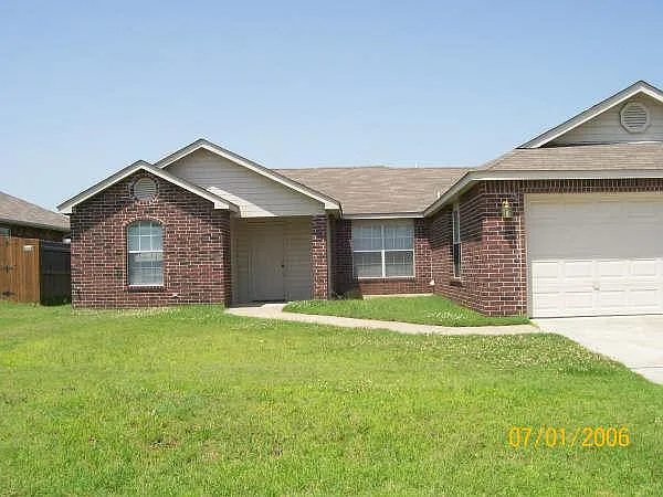 Front with entry and attached garage