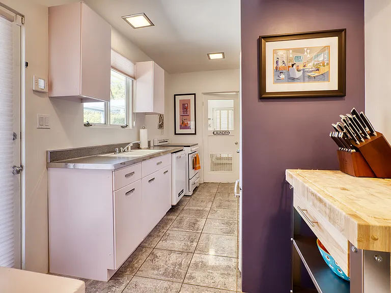 Original 50s kitchen sink and aluminum cabinets.