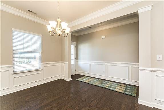 MODEL HOME PICTURE- Formal Dining Space and Foyer  Includes Chair Rail & Wainscoting!