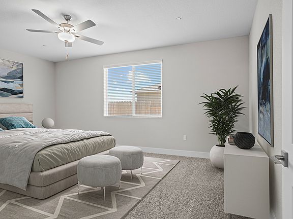 The master bedroom has enough room for a king bed and side tables.