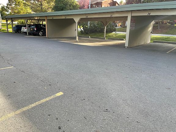 Camera monitored parking. 1 assigned carport parking and another tenant lot in back of building. Guest parking directly across from carport. All well lit and monitored.