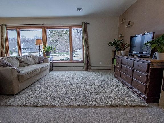 THE FAMILY ROOM WITH LARGE WINDOWS PERFECTLY FRAMES THE BEAUTY OF THE BACKYARD AND ALLOWS TONS OF NATURAL LIGHT