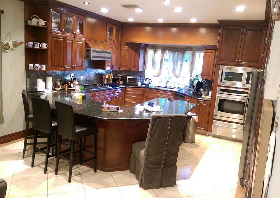 Big, beautiful kitchen with stainless steel appliances.