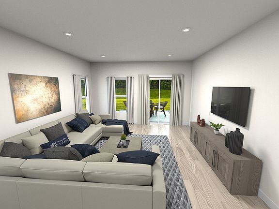 Living area with views of covered patio.