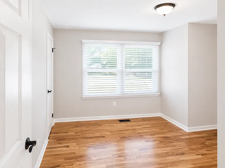All three bedrooms feature newly refinished hardwood flooring and this room with spacious layout and double-door closet.