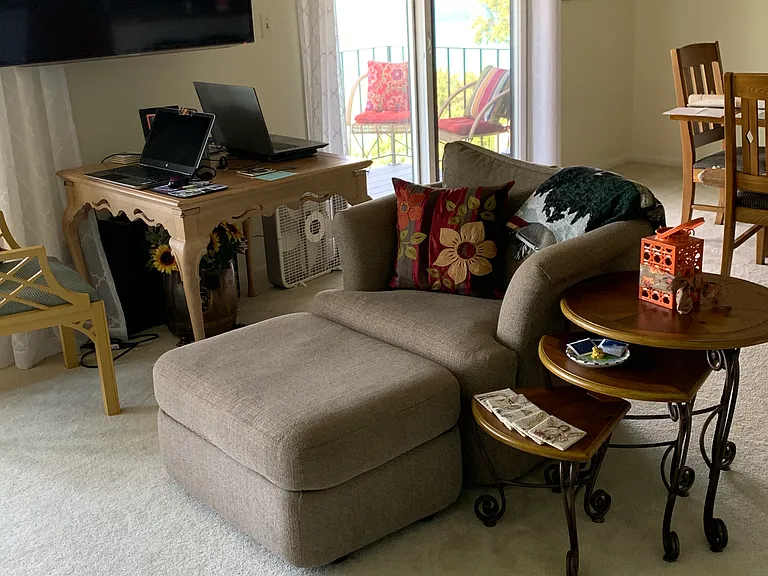 TV mounted on wall 
Table under TV not included