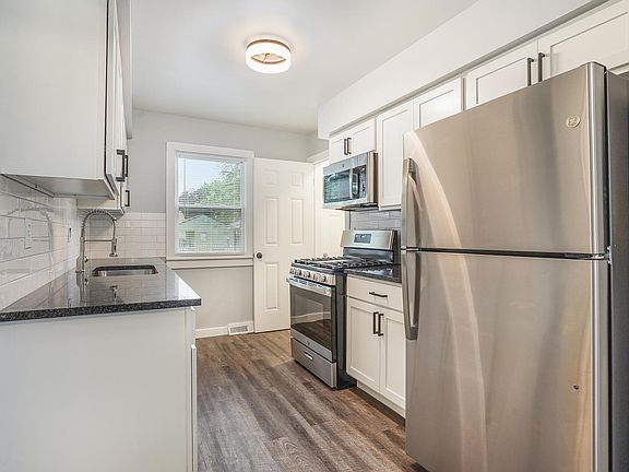 Kitchen; basement access and backyard entry