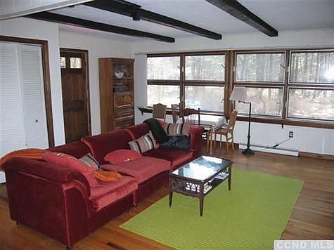 Large open plan living/dining room with hardwood floors.