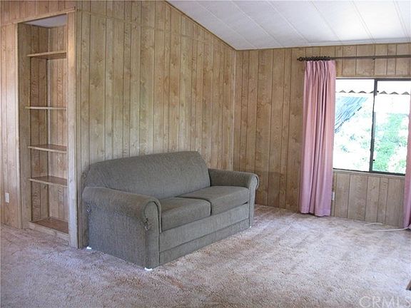 Spacious living room with vaulted ceilings and lots of windows to let in the light.
